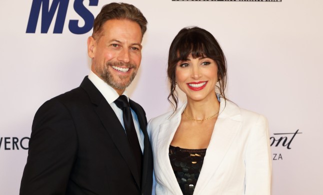 Ioan Gruffudd and Bianca Gruffudd in black and white suits stood together.