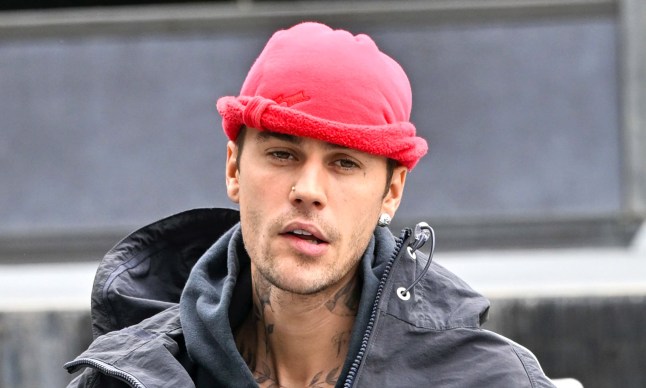Justin Bieber in a coat and red hat