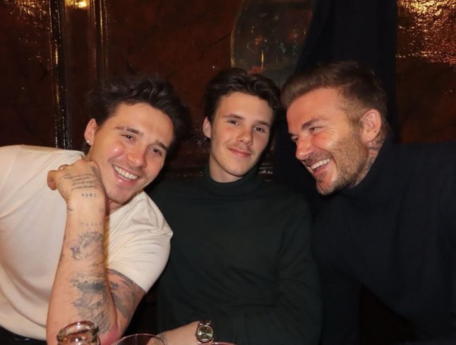 David Beckham laughing with his sons Brooklyn and Cruz