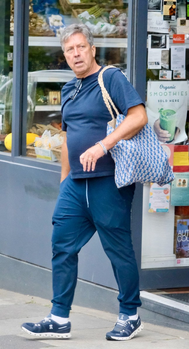 Exclusive - TV chef John Torode marked his 60th birthday with a low-key outing, seen for the first time since he was sacked from Masterchef. He was spotted walking his dog and picking up healthy ingredients at an organic food store in North London. Pic TillenDove 230725