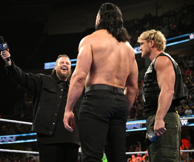 CLEVELAND, OHIO - JULY 25: Jelly Roll is happy to see Logan Paul has backup in the form of Drew McIntyre during SmackDown at Rocket Mortgage Fieldhouse on July 25, 2025 in Cleveland, Ohio. (Photo by WWE/Michael Marques/WWE via Getty Images)