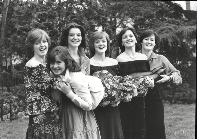 Mandatory Credit: Photo by Ted Blackbrow/ANL/Shutterstock (1510999a) Pop Group The Nolan Sisters L-r Linda Nolan Anne Nolan Bernadette Nolan Maureen Nolan Denise Nolan And Coleen Nolan (being Held) Pop Group The Nolan Sisters L-r Linda Nolan Anne Nolan Bernadette Nolan Maureen Nolan Denise Nolan And Colleen Nolan (being Held)