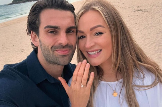 A selfie of Adam Collard and Laura Woods getting engaged on the beach
