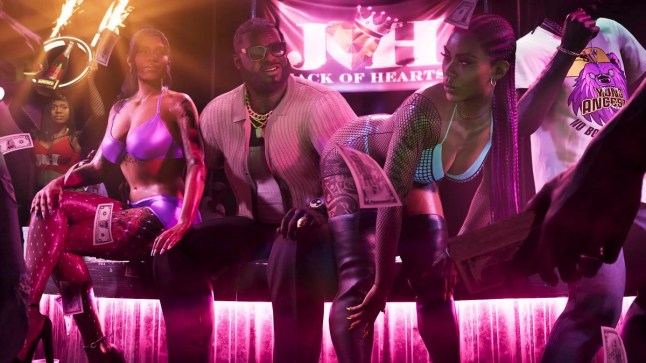 GTA 6 man in strip club sitting between two women while money falls from above