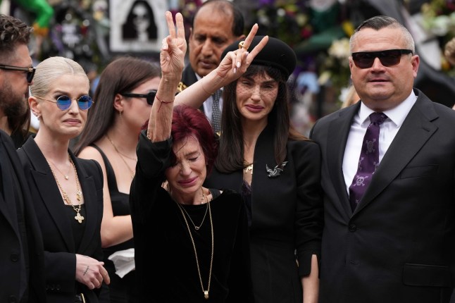 BIRMINGHAM, UNITED KINGDOM - JULY 30: The wife of Ozzy Osborne Sharon Osbourne mourns during the funeral ceremony of Ozzy Osbourne in Birmingham on 30 July 2025. Ozzy Osbourne, the iconic front man of Black Sabbath and one of the most influential British figures in heavy metal music, has died at the age of 76. (Photo by Loannis Alexopoulos/Anadolu via Getty Images) (L-R) Kelly (blue glasses) Sharon, daughter Aimee and Louis (son of Ozzy and Thelma Riley)