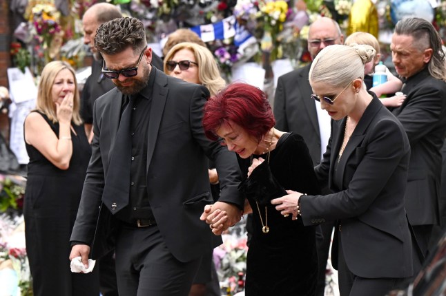 *** BESTPIX *** BIRMINGHAM, ENGLAND - JULY 30: (L-R) Jack Osbourne, Sharon Osbourne and Kelly Osbourne arrive to view tributes to the late Ozzy Osbourne from fans as his funeral cortege travels through his home city of Birmingham on July 30, 2025 in Birmingham, England. The Black Sabbath frontman passed away on July 22nd at the age of 76. His death occurred just a little over two weeks after his final live performance at the 'Back to the Beginning' concert in his hometown of Birmingham. (Photo by Leon Neal/Getty Images)