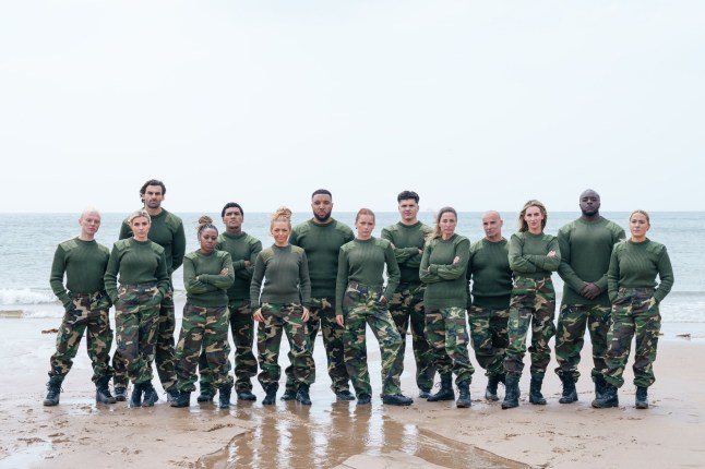 Group shot of all recruits lined up on beach in Celebrity SAS