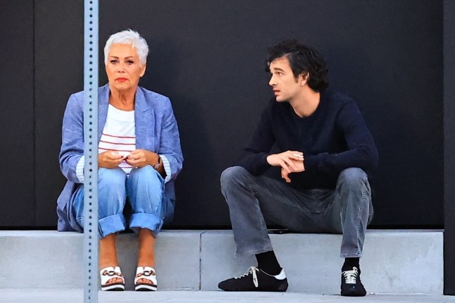 Denise Welch and Matty Healy on the sidewalk in America