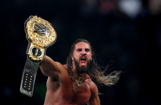 EAST RUTHERFORD, NEW JERSEY - AUGUST 02: Seth Rollins celebrates after winning the WWE World Heavyweight Championship after cashing in his Money in the Bank contract to take on CM Punk during the WWE 2025 SummerSlam at MetLife Stadium on August 02, 2025 in East Rutherford, New Jersey. (Photo by Elsa/Getty Images)