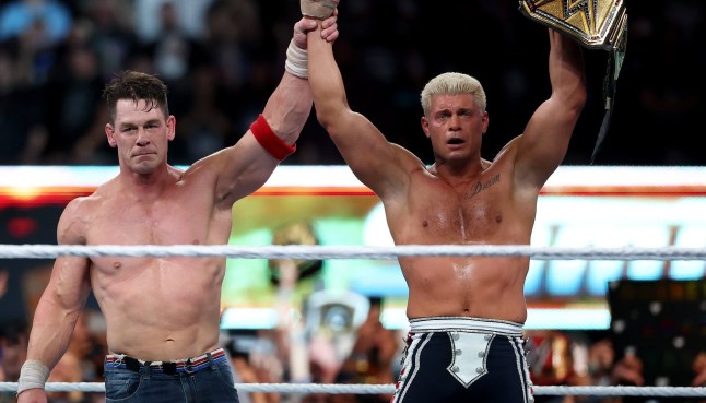 EAST RUTHERFORD, NEW JERSEY - AUGUST 03: John Cena congratulates Cody Rhodes after Rhodes won and became the WWE Undisputed Champion during the WWE 2025 SummerSlam at MetLife Stadium on August 03, 2025 in East Rutherford, New Jersey. (Photo by Elsa/Getty Images)