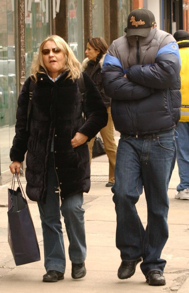 NEW YORK - MARCH 14: (NY DAILY NEWS OUT / NEWSDAY OUT / ITALY OUT) Actor Leonardo DiCaprio (R) uses his down jacket to cover up as he walks with his mother, Irmalin, after having brunch at Cafe Gitane on Mott Street March 14, 2004 in New York City. (Photo by Arnaldo Magnani/Getty Images)