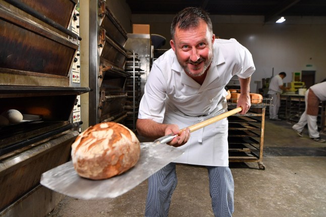 Mandatory Credit: Photo by Bruce Adams/ANL/Shutterstock (8995849a) Weekender - Baker Lee Hollywood 45 Brother Of TV Chef Paul Hollywood At Work Removing Bread From His Oven In His Bakery 'born And Bread' In Moreton Merseyside. - 27/7/16. Weekender - Baker Lee Hollywood 45 Brother Of Tv Chef Paul Hollywood At Work Removing Bread From His Oven In His Bakery 'born And Bread' In Moreton Merseyside. Pic Bruce Adams / Copy Hull - 27/7/16.