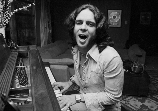 Bobby Whitlock sings and plays the piano in his home. (Photo by Herb Kossover/Getty Images)
